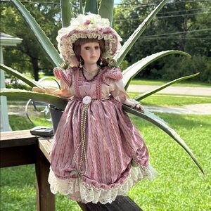 Elegant Pink Porcelain Doll with Lace Dress